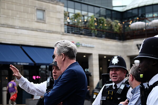 Wimbledon MP Paul Kohler with local police officers