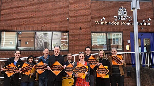 Lib Dems outside Wimbledon police station